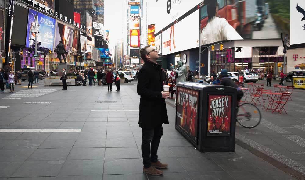 Man buying Broadway tickets in Times Square