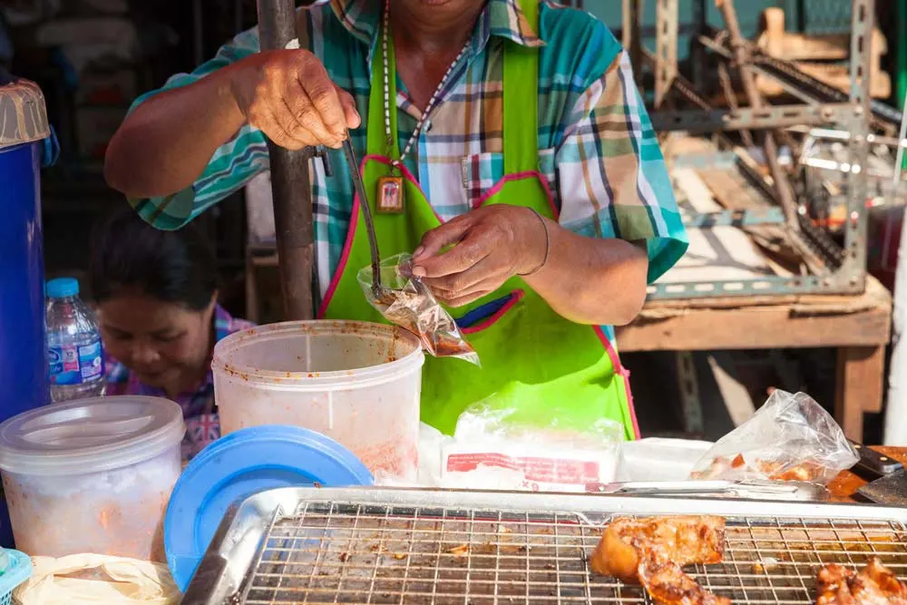 Thai local serving food at Wang Lang Market