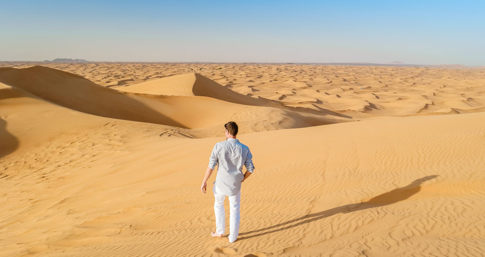 Man in Desert experience Extreme Sports in Dubai